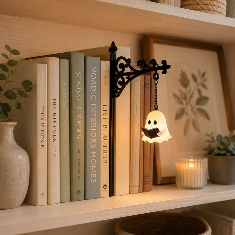 Ghost bookshelf light adding a cozy glow to a reading shelf