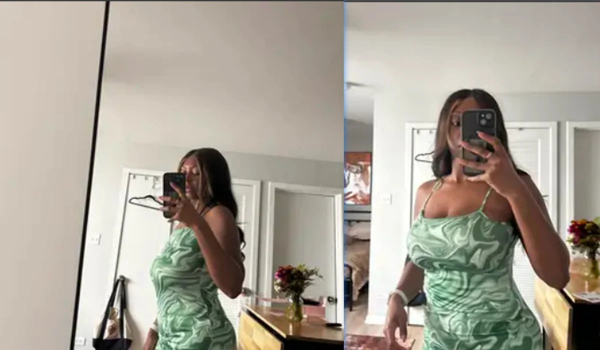 Woman showing the fit of a close-fitting green dress